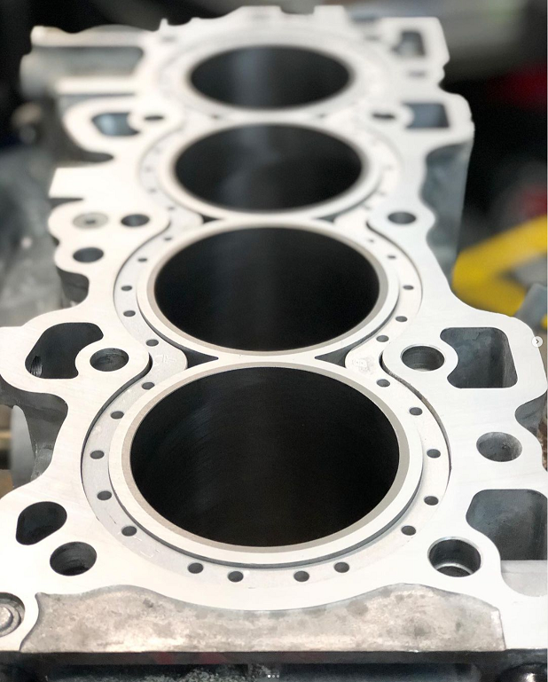 Engine block assembly undergoing machining